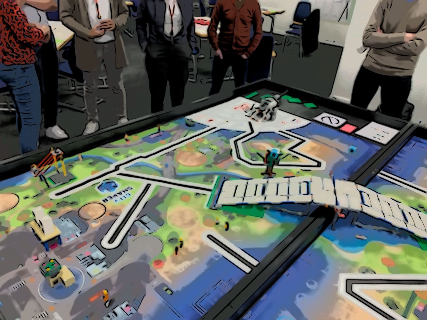 The LEAT table: a LEGO® city on a play mat, with participants standing around it